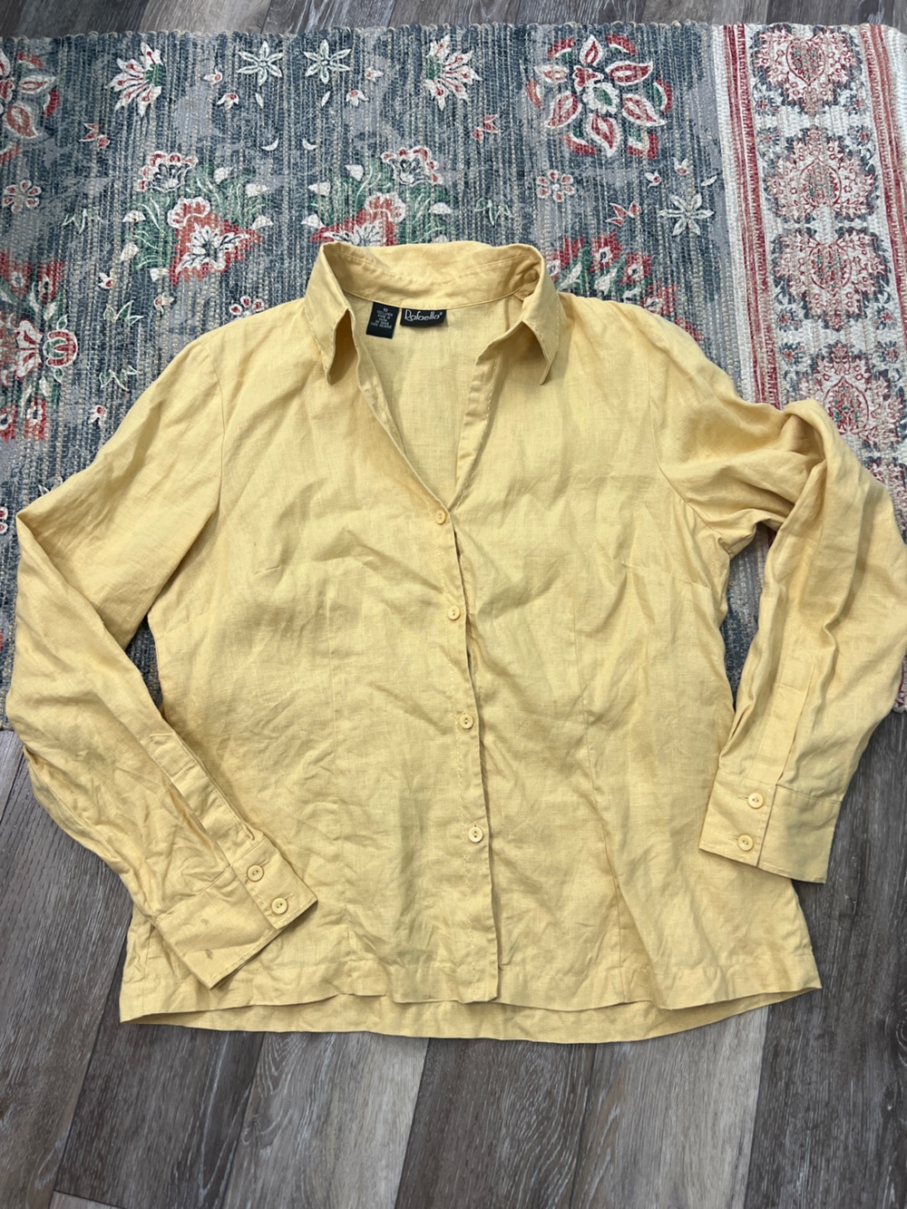 Rafaella linen button-up shirt features long sleeves and a collared necklin